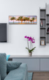 a living room with a blue couch and a painting on the wall