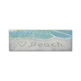 a picture of a beach with the word beach written in the sand