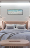 a bedroom with a bed and a bench