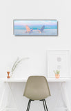 a white desk with a chair and a picture on it